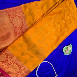 a vibrant mustard yellow art silk saree